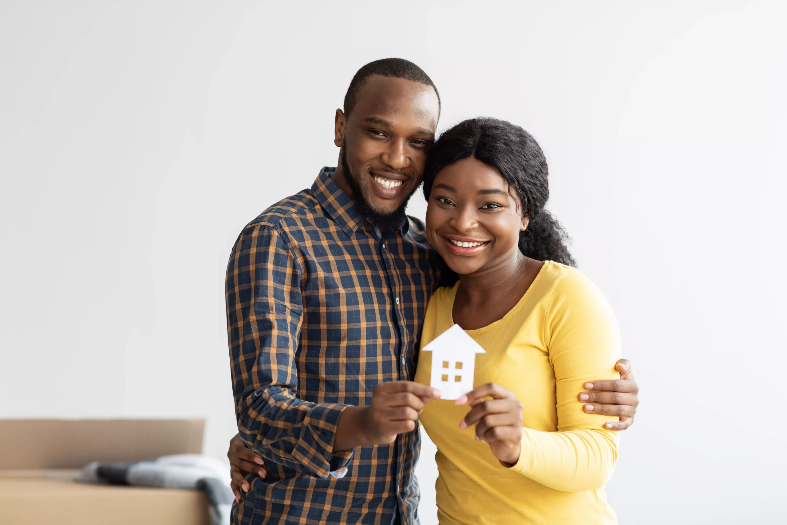 family-housing-concept-joyful-black-couple-holdin